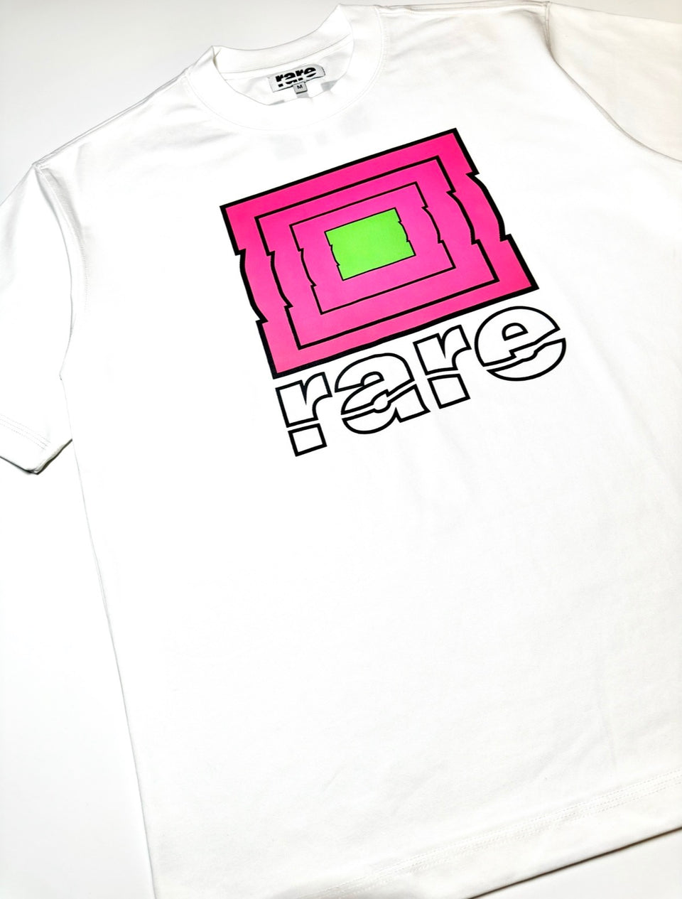 Rare Stool Symbol t-shirt in white with rose pink, green and black print. 
